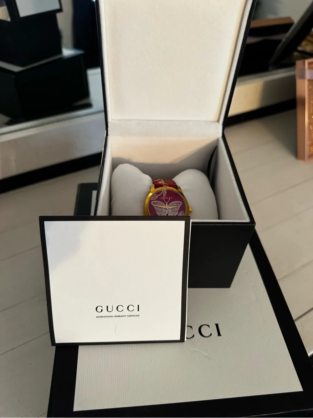Gucci Gold-Tone Case Watch with Red Butterfly Strap